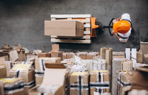 young-man-working-warehouse-with-boxes (1)